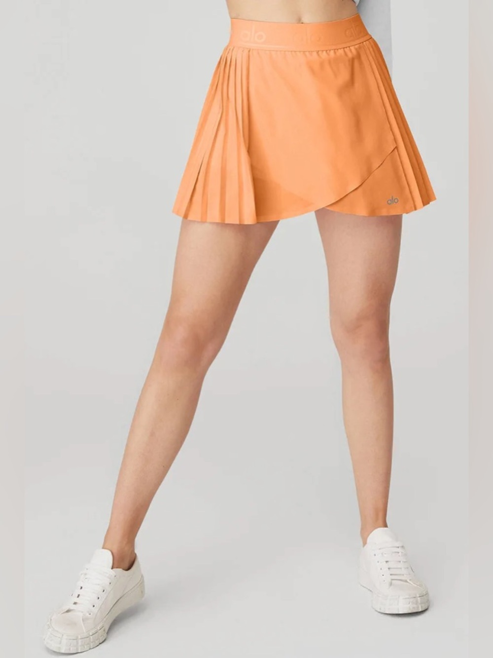 ALO Yoga Aces Tennis Skirt in Cantaloupe